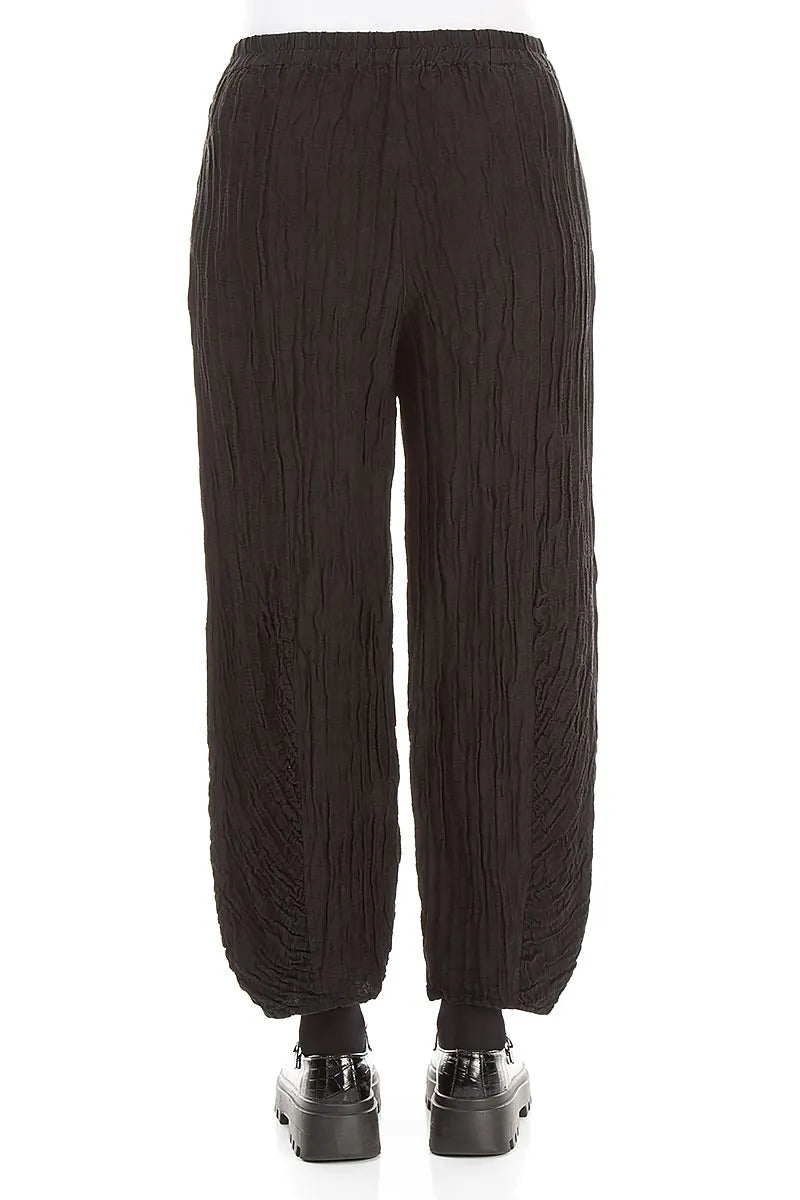 Schwarze Hose aus gekräuseltem Seidenleinen mit gerüschtem Saum