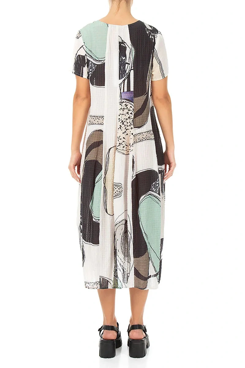 Robe en soie texturée motif galets coupe ballon