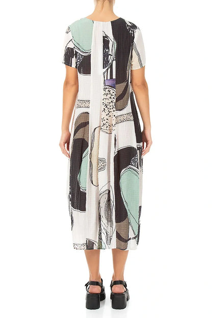 Robe en soie texturée motif galets coupe ballon