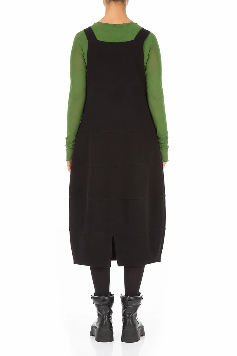 Schwarzes Latzkleid aus Baumwolljersey mit Ballonärmeln