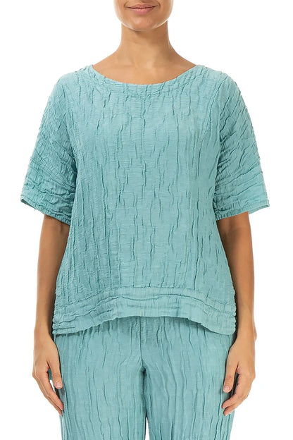 Bluse aus mintfarbenem Seidenleinen mit horizontalem Saum und Knittereffekt