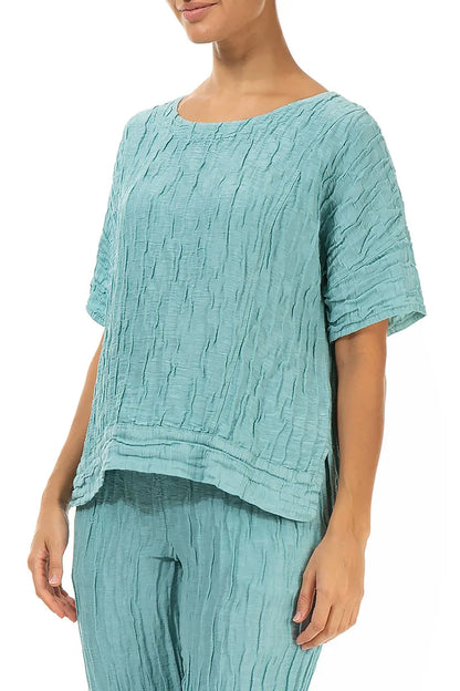 Bluse aus mintfarbenem Seidenleinen mit horizontalem Saum und Knittereffekt