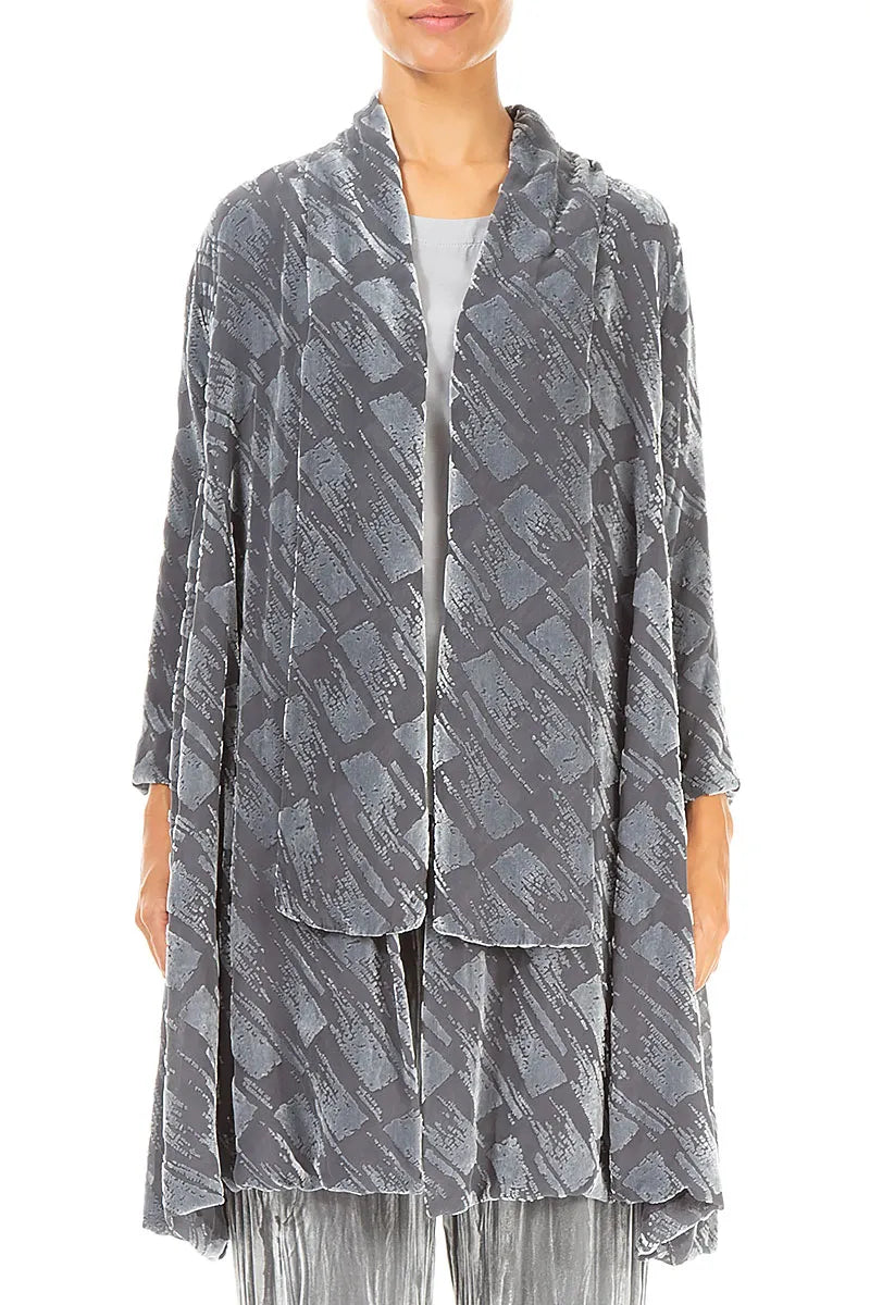 Person wearing a long, patterned gray jacket on a white background