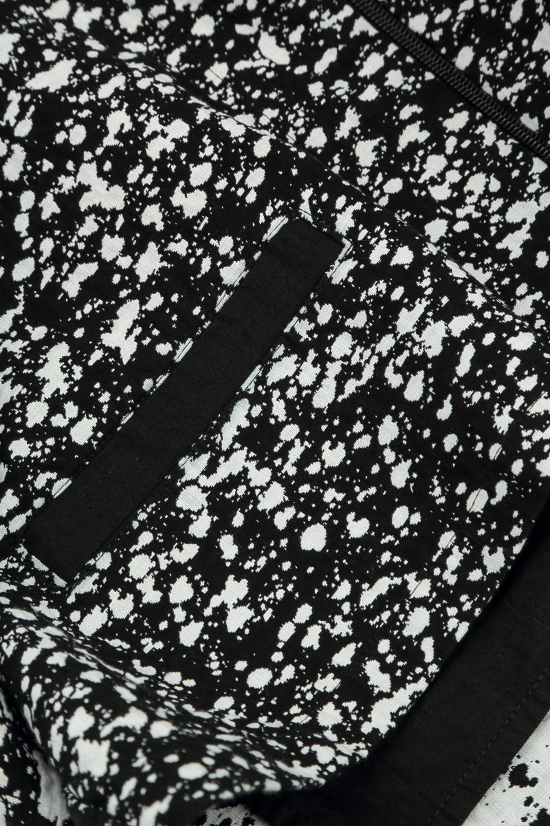 Wendbare Jacke aus gesprenkelter schwarz-weißer Baumwolle