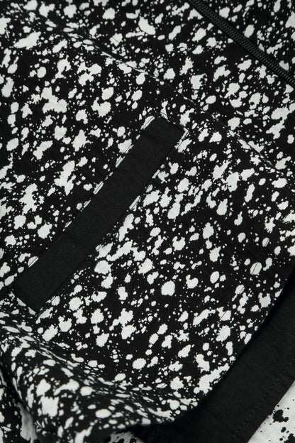 Wendbare Jacke aus gesprenkelter schwarz-weißer Baumwolle