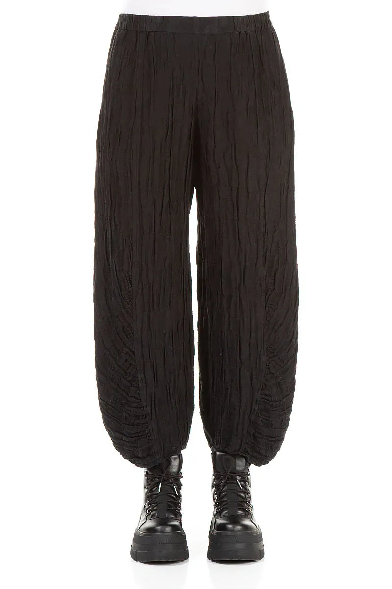 Schwarze Seidenleinenhose mit gerüschtem Saum und Kreisen