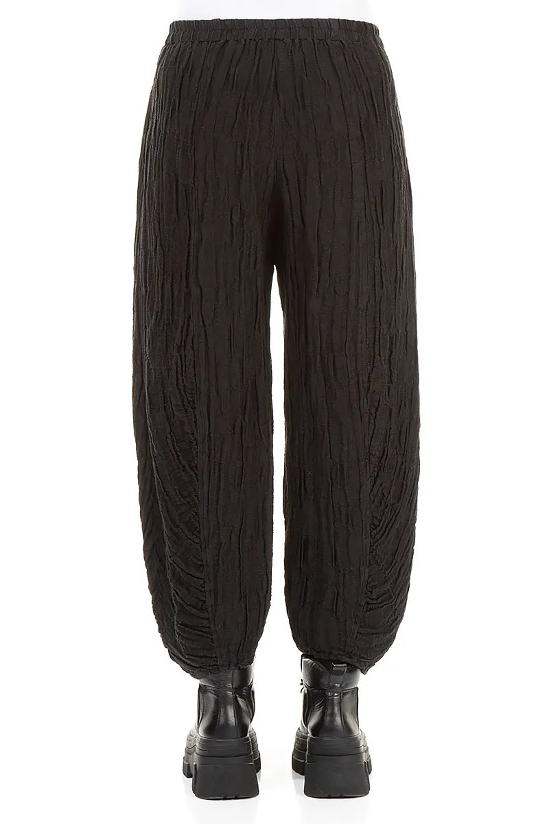 Schwarze Seidenleinenhose mit gerüschtem Saum und Kreisen