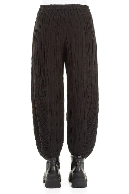 Schwarze Seidenleinenhose mit gerüschtem Saum und Kreisen